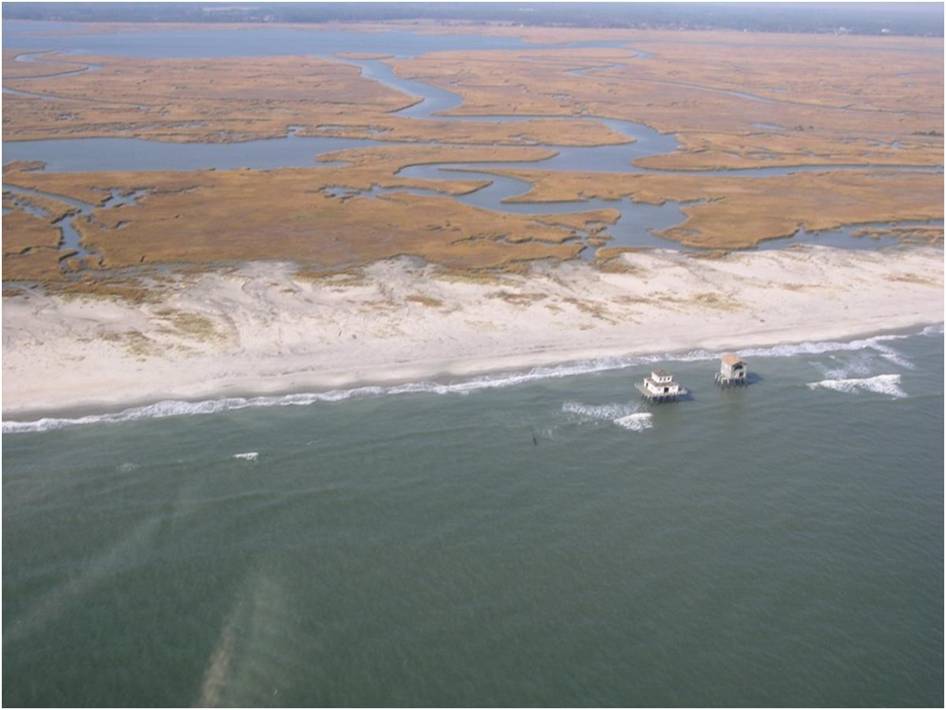 Abandoned houses stranded from rapid shoreline change